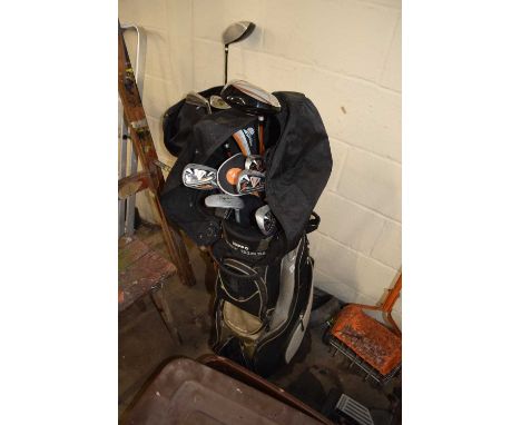 A Hippo golf caddy and a quantity of clubs