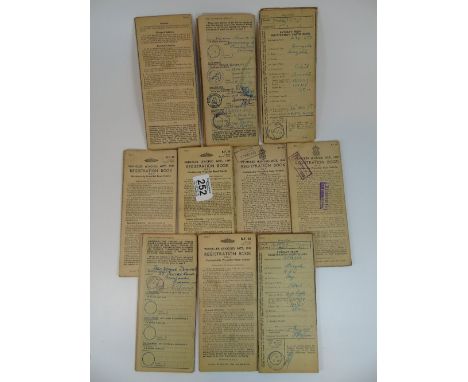 10 VINTAGE MOTOR CYCLE REGISTRATION BOOKS, INCLUDING 1 X LAMBRETTA