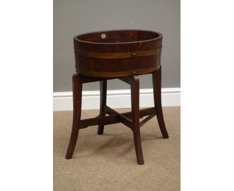 Early 20th century oval oak and metal bound planter on stand, labelled 'R. Alister & Co. LTD', W46cm, H59cm   Condition Repor