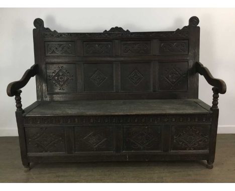 VICTORIAN OAK HALL BENCH, MID - LATE 19TH CENTURY with carved panelled back, swept armrests on bobbin turned supports, hinged
