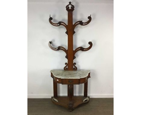 VICTORIAN OAK HALLSTAND, LATE 19TH CENTURY the pierced scroll arms fitted with a series of coat hooks, the shaped base with m