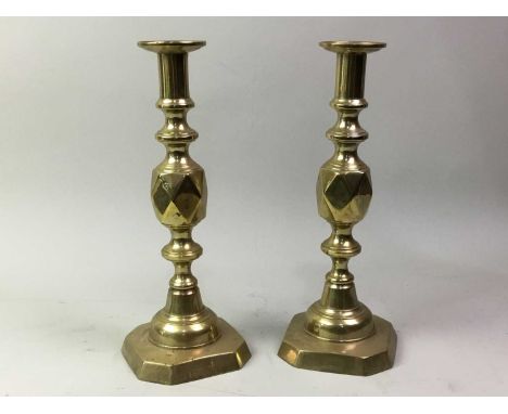 PAIR OF BRASS CANDLESTICKS, EARLY 20TH CENTURY stamped 'THE KING OF DIAMONDS' to base, along with three further pairs and a s