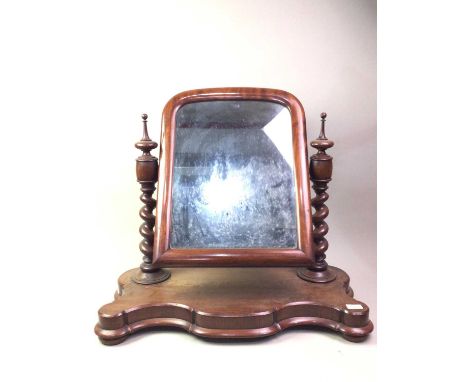 VICTORIAN MAHOGANY DRESSING TABLE MIRROR, the oval glass on barley twist supports over a serpentine base to bun feet, along w