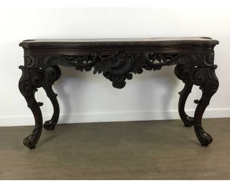 VICTORIAN OAK CONSOLE TABLE, MID -  LATE 19TH CENTURY of Rococo design, the serpentine top with carved edge, over a pierced a