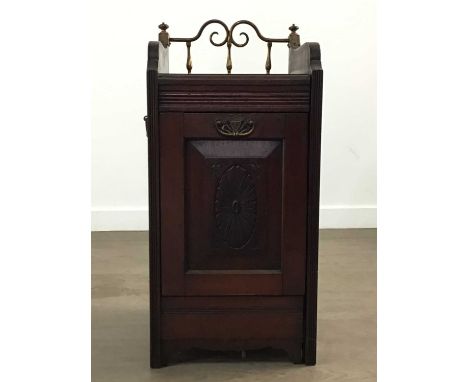 VICTORIAN MAHOGANY COAL SCUTTLE, LATE 19TH CENTURY with raised brass gallery to back, the panelled door carved with central o