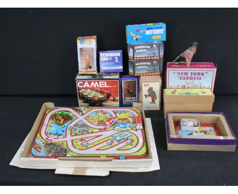 Collection of mixed toys and games to include boxed Duck On Bike Wind-Up toy, Butterfly Turn Over, boxed Drumming Animal, box