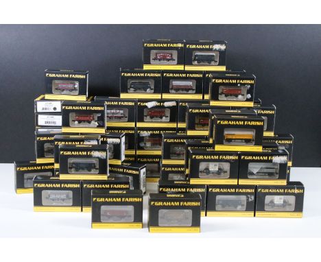63 Boxed Graham Farish N gauge items of rolling stock to include 373-261A Cattle Wagon GWR dark grey, 373-261B Cattle Wagon G