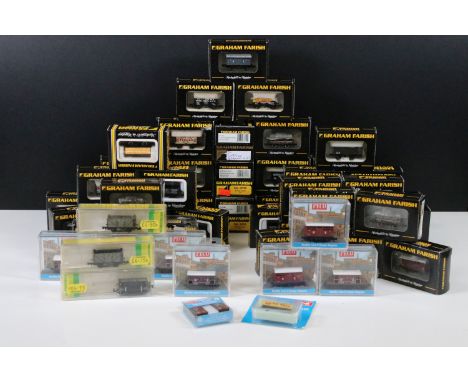 56 Boxed / cased N gauge items of rolling stock to include 45 x Graham Farish, 8 x Peco and 3 x Minitrix featuring vans, and 