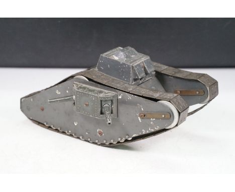 Scratch built tin plate and aluminium clockwork model of a WW1 tank, with moving side cannons