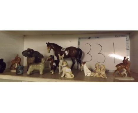 A SHELF OF CHINA ANIMALS