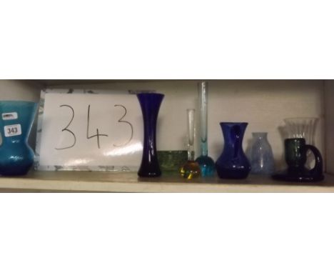 SHELF OF BLUE GLASS VASES