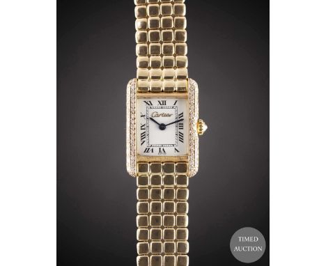 A LADIES 18K SOLID GOLD CARTIER TANK BRACELET WATCH
CIRCA 1990s
Movement:&nbsp;Quartz, signed Cartier.
Case:&nbsp;Approx. 25m