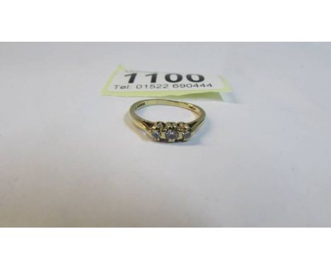 A vintage three stone 9ct gold ring, hall marked London, size J half, 1.88 grams.