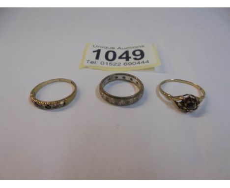 Two 9ct gold rings, sizes K &amp; L and a 9ct gold eternity ring size J. 4.4 grams.