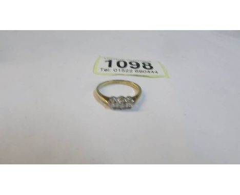 A vintage diamond three stone quarter carat ring in gold shank, size O, 1.77 grams.
