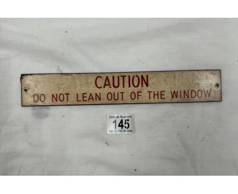 A vintage railway carriage Caution "Do Not Lean Of Of The Window" sign