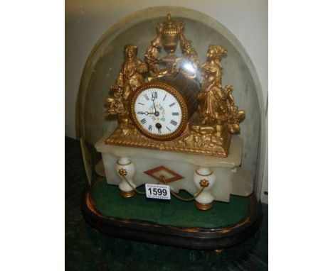 A Victorian mantel clock surmounted figures and under glass dome. in working order. COLLECT ONLY.