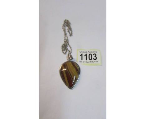 A vintage jasper pendant set in silver.