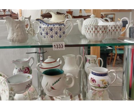 A quantity of teapots, sugar bowls &amp; milk jugs by Spode, Royal Worcester, Port Meirion &amp; Minton