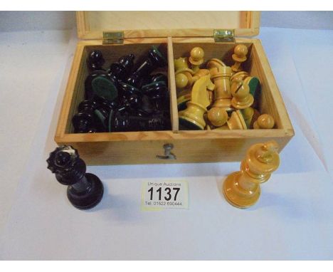 A boxed vintage weighted wooden chess set.