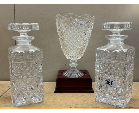 A crystal vase on wooden base &amp; 2 glass decanters