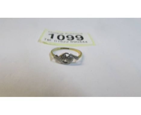 An art deco platinum mounted two stone diamond ring, marked 18ct Plat, size G, 1.42 grams/