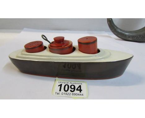 An art deco ceramic condiment set of an ocean liner, 18 cm long.
