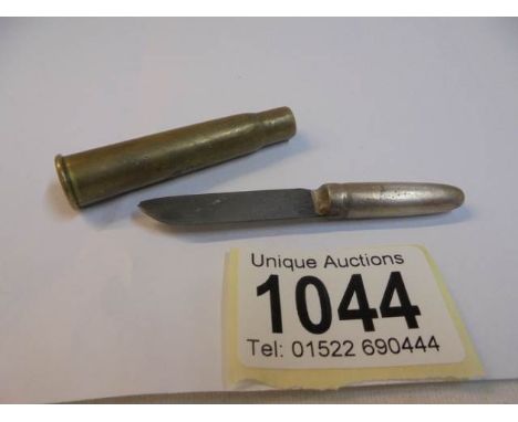 A WW1 trench art bullet knife.