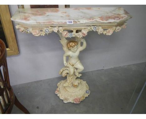 A good quality console table supported by a cherub, COLLECT ONLY.