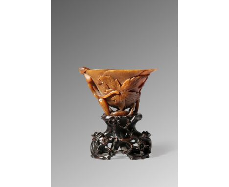 λ A CHINESE RHINOCEROS HORN 'MAGNOLIA' LIBATION CUP 17TH/EARLY 18TH CENTURY The flaring body shaped as a magnolia flowerhead,