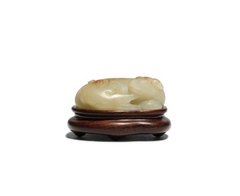 A CHINESE CELADON JADE 'BADGER' GROUP LATE MING DYNASTY Formed as a badger lying down with her cub curled up by her side, the