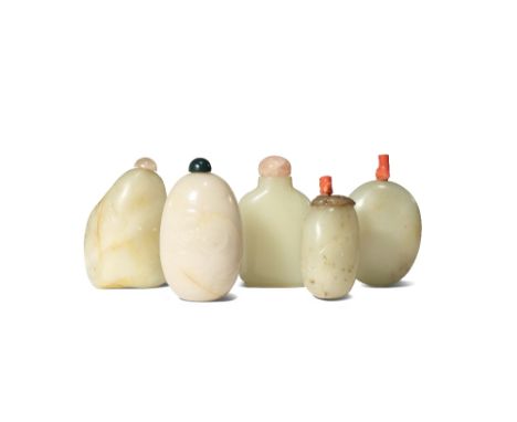 FIVE CHINESE WHITE AND CELADON JADE SNUFF BOTTLES QING DYNASTY One of flattened rectangular form, the others pebble jade, one