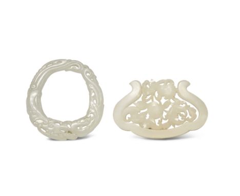 TWO CHINESE PALE CELADON JADE PENDANTS QING DYNASTY One carved in openwork with a peach, pomegranate and finger citron growin