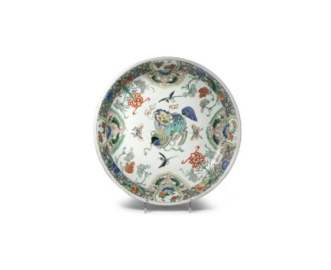 A LARGE CHINESE FAMILLE VERTE 'LION DOG' DISH KANGXI 1662-1722 Painted to the centre with a lion dog playing with a brocade b
