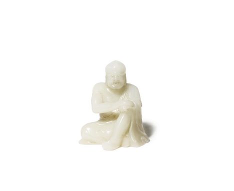 A CHINESE WHITE JADE CARVING OF A LUOHAN PROBABLY 18TH CENTURY The figure depicted seated with both hands resting on his rais