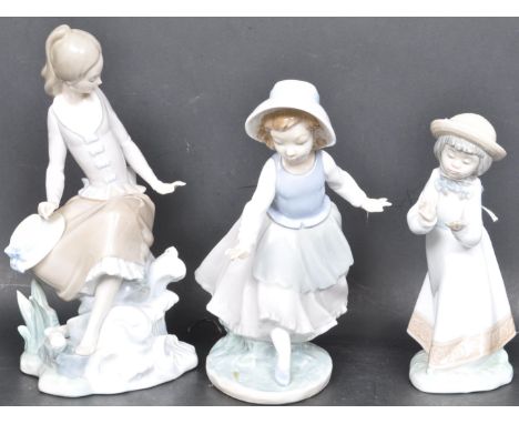 A collection of vintage 20th century porcelain figurines comprising of a LLadro figurine of young girl sat by water together 