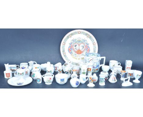 A large collection of early 20th century goss ware porcelain and crested china to include pieces crested for Bridport, Seaton