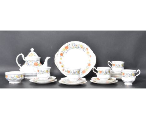 A Royal Standard bone China tea service. Chintz Art Nouveau foliate pattern being stamped to underside. The set comprising te