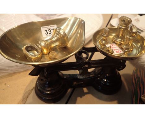 Set of cast iron scales with brass pans and bell weights