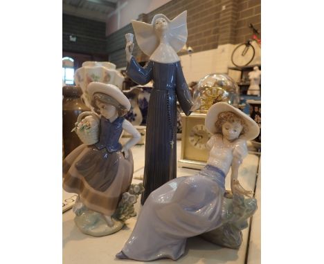 Two Lladro figurines and one Nao CONDITION REPORT: Girl with flower basket has one petal damaged. Other is lacking one finger