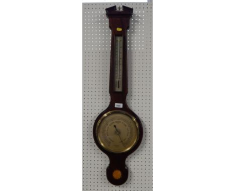 A Russell of Norwich mahogany cased aneroid wheel barometer, with thermometer and sunburst inlay.