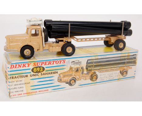 French Dinky Toys, 893 Unic Sahara pipe transporter, beige body with white roof, with glazing, 6 black pipes, in the original