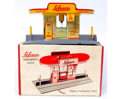 Schuco Varianto No.3055 Service Station comprising of grey plastic base with detailed tin printing to building and canopy, co