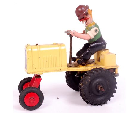 DCMT Harry Hayseed Tricky Tractor, yellow body with black rubber rear wheels, red metal front wheels with black tyres, clockw