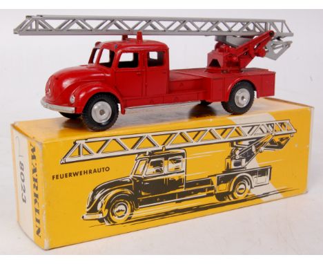 Marklin, No. 8023, Marquis fire engine, red body with silver trim and ladder, cast spun hubs, in the original all card yellow