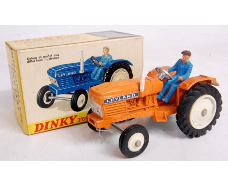 Dinky Toys, 308, Leyland 384 Tractor, orange body with white hubs, blue driver, in the original white panel all card picture 