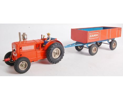 Gama (US Zone) early 1950s clockwork tractor and farm trailer, orange body, blue/orange trailer, keywound via starting handle