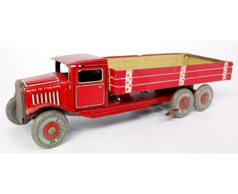 Mettoy (UK) tinplate 6-wheeled Tipper, Post-war variation is deep red, with tinprinted balloon wheels, clockwork with fixed p