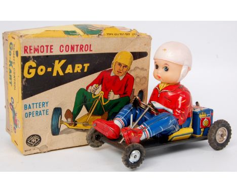 Modern Toys of Japan, tinplate and battery operated Go-Kart, with remote control steering via a wire, comprising of blue, whi