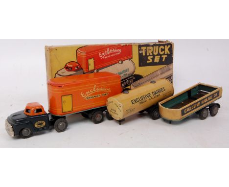 Alps (Japan) tinplate truck and 3 trailer gift set, comprising friction drive exclusive tractor unit with matching closed tra